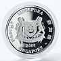 Singapore set of 2 coins 5 dollars Orchids flora silver coloured coin 2009